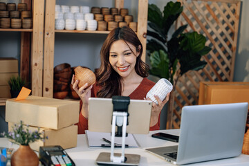 A Small business owner is live streaming to sell vases online. Manage e-commerce inventory, process orders, build trust with customers through reliable delivery to ensure a good shopping experience.