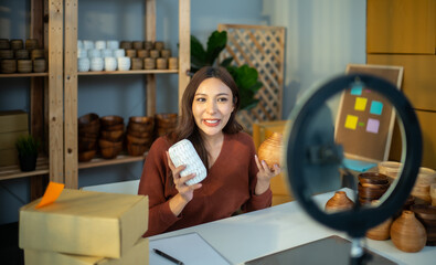 A Small business owner is live streaming to sell vases online. Manage e-commerce inventory, process orders, build trust with customers through reliable delivery to ensure a good shopping experience.