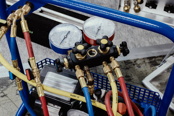 Manometric manifold. The hoses are connected to pressure gauges. - obrazy, fototapety, plakaty