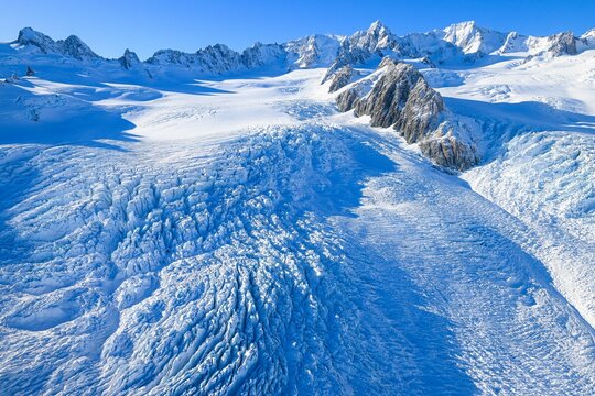 An aerial view from a helicopter of snow on Mount Cook, New Zealand.
