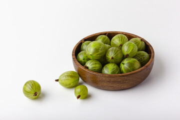 Gooseberry in a wooden bowl