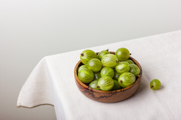 Gooseberry in a wooden bowl