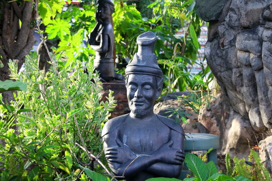 Thai hermit statue in stretching posture or Thai yoga for self healthcare in Wat Pho, Thailand.