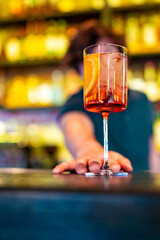 man hand bartender making cocktail in glass on the bar counter