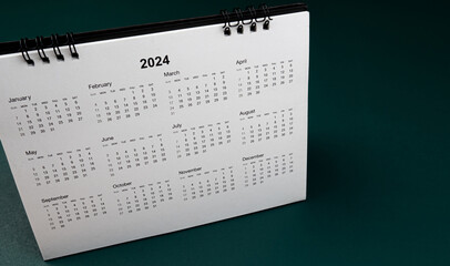 Calendar year 2024 schedule on green dark background.
2024 calendar planning appointment meeting...