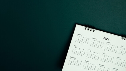 Calendar year 2024 schedule on green dark background.
2024 calendar planning appointment meeting concept. 
copy space.
top view.