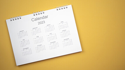 Calendar year 2023 schedule on yellow background.
2023 calendar planning appointment meeting...