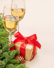 Xmas fir tree branch, Christmas gift box, champagne and space