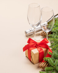Xmas fir tree branch, Christmas gift box, champagne and space