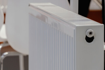 White heating radiator close-up indoors.