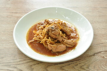 stir fried spicy chicken with slice ginger in soy sauce on plate  