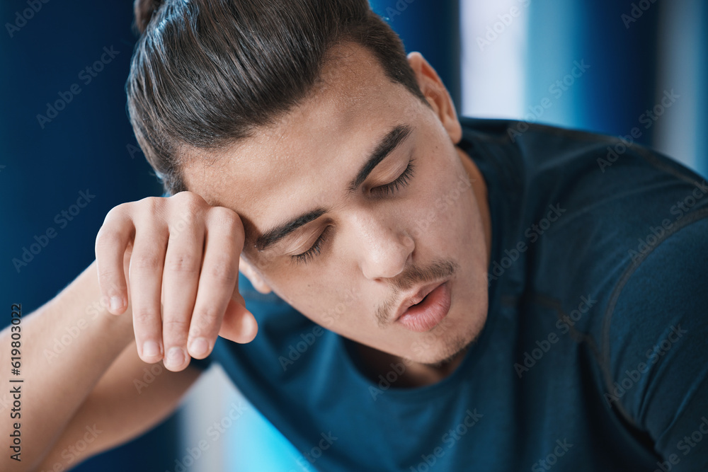 Poster Exercise, sweat and a tired sports man breathing in the gym after an intense or physical workout for health. Fitness, fatigue and a young male athlete or runner finished with his cardio training