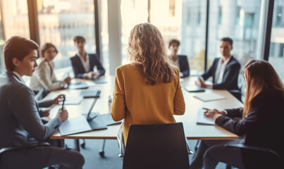 Woman manager leading the team meeting, colleagues in a boardroom discussing a project generative AI - 619803477