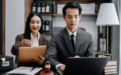 Business people and lawyers discussing contract papers sitting in the table at office in the morning. concepts of law, advice, legal services.