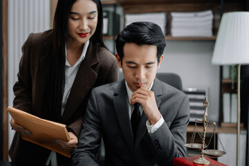 Business people and lawyers discussing contract papers sitting in the table at office in the morning. concepts of law, advice, legal services.