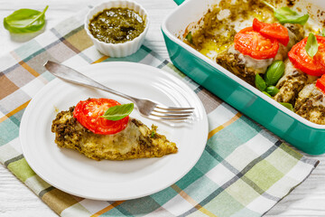 chicken breasts with pesto sauce, cheese, tomato