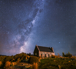 Fototapeta na wymiar The Milky Way rises over the back of the Church of the Good Shepherd in Lake Tekapo, New Zealand. 