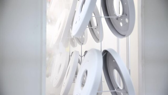 Powder coating line, painting products in an electrostatic field.