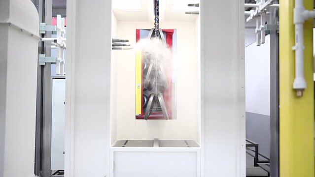 Powder coating line, painting products in an electrostatic field.