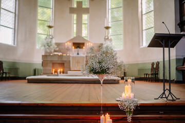 The interior of the church is adorned with beautiful stained glass windows, ornate wooden pews, and a magnificent altar