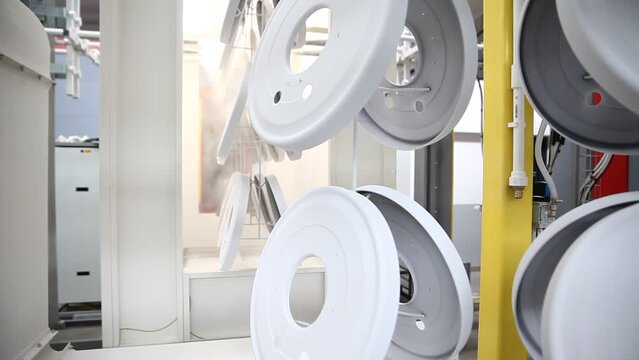 Powder coating line, painting products in an electrostatic field.