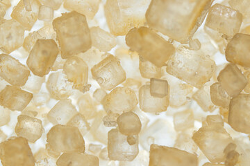 Closeup top view brown sugar crystal background (shallow DOF)