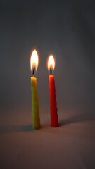 two color candles burning