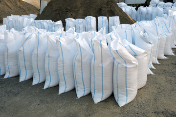 Close-up of many bags of gravel or sand for construction and renovation.