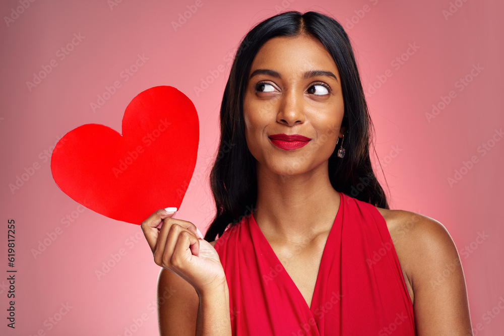 Sticker Woman, paper heart and thinking in studio with makeup, beauty and romantic sign by red background. Young girl, ideas and cardboard emoji with love for cosmetics, valentines day date and aesthetic