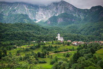 Fototapeta na wymiar Drežnica village near Kobarid, under Mount Krn Slovenia. Picturesque rural green landscape