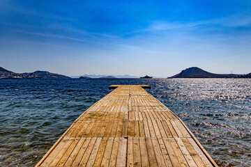 Wooden jetty into the beautiful Aegean Sea on the north peninsular of Bodrum.