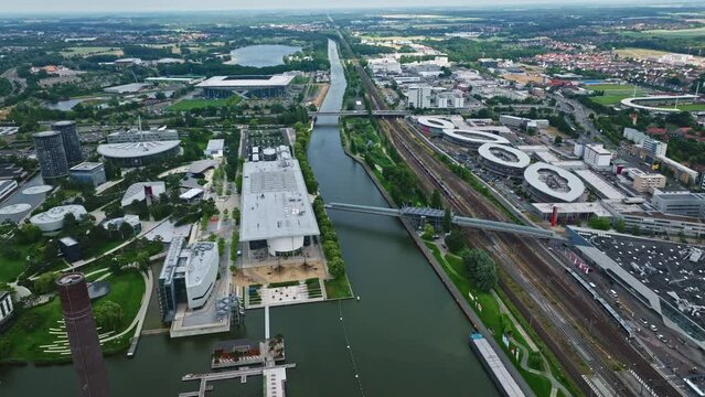 Drone shot of Wolfsburg city , Germany . It's known as the headquarters for Volkswagen and for the Autostadt, an automobile-themed park with a classic-car museum and driving track.