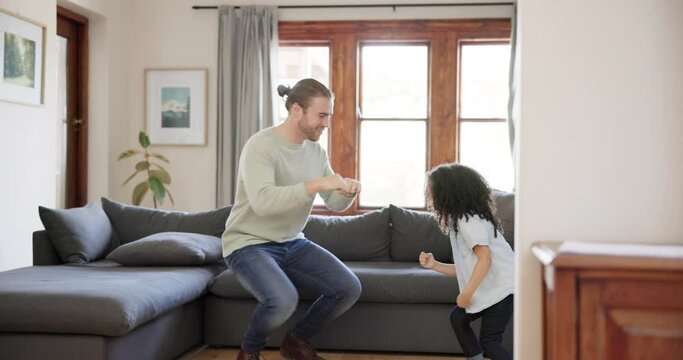 Music, dance and father with girl child in a living room having fun, happy and bonding in their home together. Love, family and parent with kid in a lounge learning, playing and teaching funny game