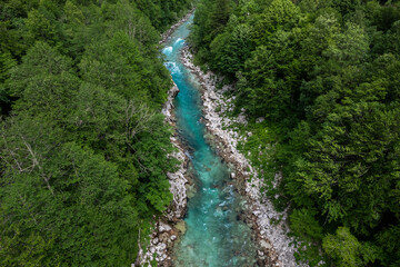 Aerial drone view of Soca river and green lush landscape in Slovenia at summer