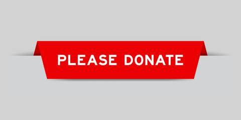 Red color inserted label with word please donate on gray background