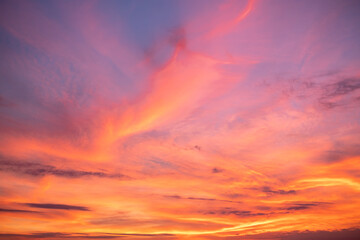 beautiful , luxury soft gradient orange gold clouds and sunlight on the blue sky perfect for the background, take in everning,Twilight