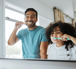 Father, son and brushing teeth together in mirror, bathroom or home for hygiene, teaching or oral...
