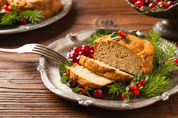 Small, baked patties in Christmas retro styling. Front view. Natural wooden background.