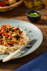 Pork chop with peppers, mushrooms and bamboo. Served with rice.