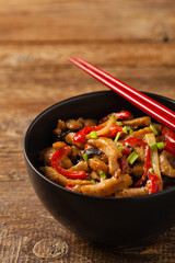 Pork chop with peppers, mushrooms and bamboo. Served with rice.