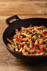Pork chop with peppers, mushrooms and bamboo. Served with rice.