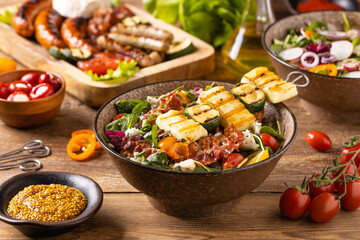 Delicious salad added to grilled dishes, with bacon and halloumi cheese.