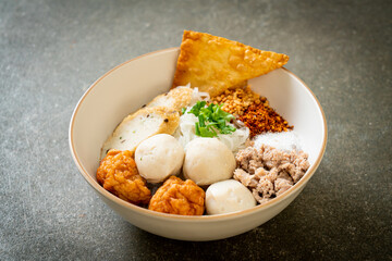 spicy small flat rice noodles with fish balls and shrimp balls without soup