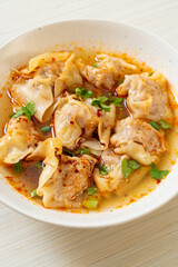 pork wonton soup or pork dumplings soup with roasted chili