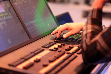 light board operator works with lighting console