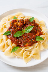 farfalle pasta with basil and garlic in tomato sauce
