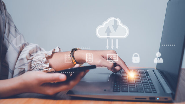 Woman use computer with cloud computing diagram show on hand.Download, upload, backup wireless conceptual,Networking and internet service concept.