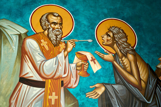 Depiction of a priest giving medicine to the poor. Depictions from the greek orthodox church of John the Baptist, Al-Maghtas (Bethany Beyond the Jordan). Baptism site of Jesus. Jordan.