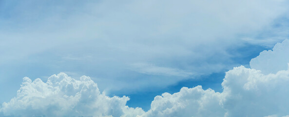 Naklejka na ściany i meble Beautiful blue sky with tiny clouds. Panoramic sky on a sunny day.
