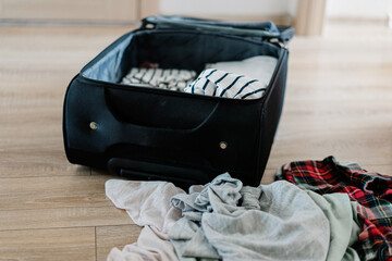 Unpacking suitcase after travel at home. High quality photo